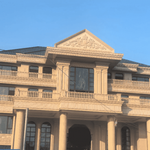 广东黄金麻别墅外墙干挂石材效果示例